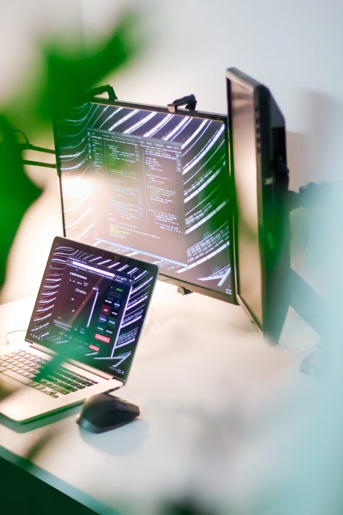a laptop computer sitting on top of a desk